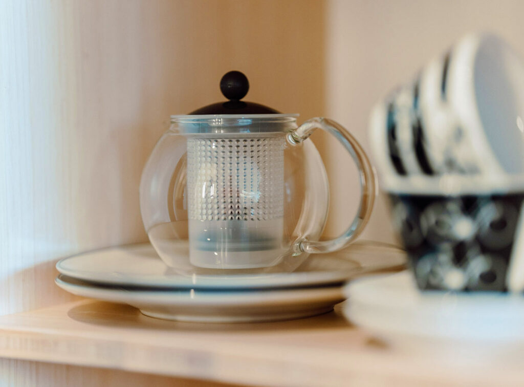 Herbal tea infuser pot in cupboard